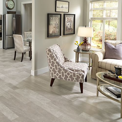 Light linoleum flooring in kitchen and sitting area